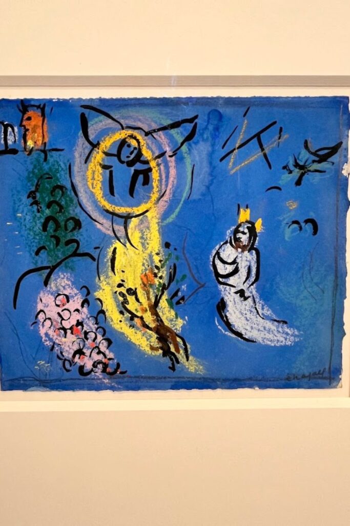 Abstract painting by Marc Chagall, featuring vibrant colors and whimsical figures, on display at the Marc Chagall National Museum in Nice. A must-see for art enthusiasts and a cultural gem to highlight in a Nice travel guide, offering insight into the artist's unique style and symbolism.